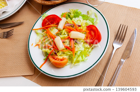 Light vegetable salad with tomatoes in a plate Light vegetable salad with tomatoes in a plate 139604593