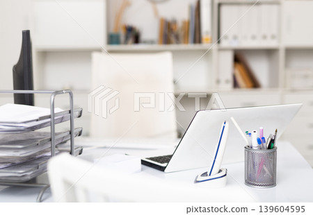 Office workplace with desktop computer monitor and laptop Office workplace with desktop computer monitor and laptop 139604595