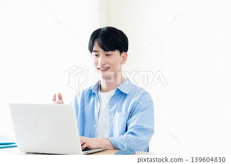 Young men having an online meeting 139604830