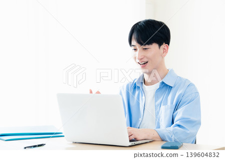 Young men having an online meeting Young men having an online meeting 139604832