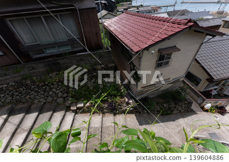 A photograph of the labyrinthine alleys of Ogijima Island in Takamatsu City, Kagawa Prefecture. A photograph of the labyrinthine alleys of Ogijima Island in Takamatsu City, Kagawa Prefecture. 139604886