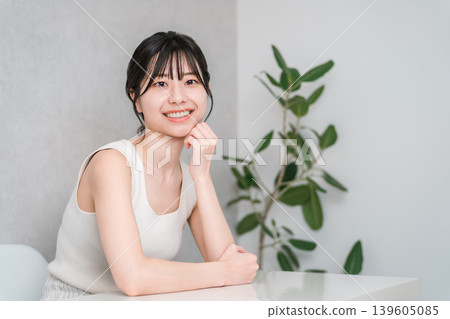 Smiling Asian woman with beautiful skin with a cheek (beauty, esthetic, skin care image) Smiling Asian woman with beautiful skin with a cheek (beauty, esthetic, skin care image) 139605085