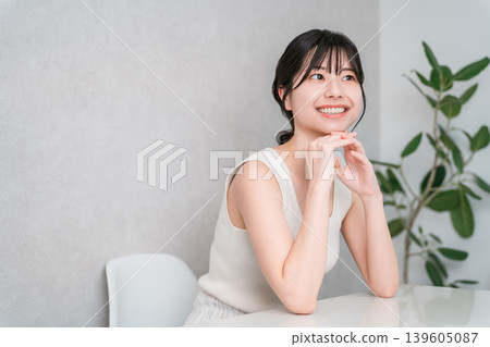 A young Asian woman with beautiful skin wearing a tank top (Beauty, Makeup, Skincare) A young Asian woman with beautiful skin wearing a tank top (Beauty, Makeup, Skincare) 139605087