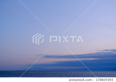 The calm seaside sky, painted in the colors of the sunset. The calm seaside sky, painted in the colors of the sunset. 139605093