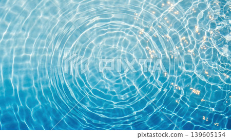 Ripples spreading across the clear blue water surface Ripples spreading across the clear blue water surface 139605154