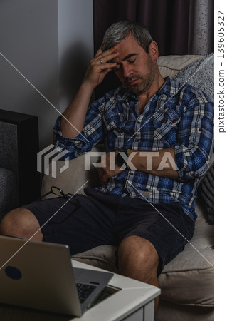 Exhausted freelancer suffering burnout while working from home 139605327