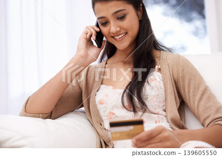 Happy woman, phone call and credit card for online shopping, payment or banking on sofa at home. Female person talking on mobile smartphone with smile for ecommerce, debit or conversation on account Happy woman, phone call and credit card for online shopping, payment or banking on sofa at home. Female person talking on mobile smartphone with smile for ecommerce, debit or conversation on account 139605550