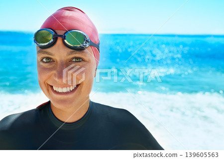 Swimmer, goggles and portrait of woman at ocean outdoor in summer for exercise, training or workout on mockup space. Sea, face or sport athlete in nature for fitness, health or triathlon at the beach Swimmer, goggles and portrait of woman at ocean outdoor in summer for exercise, training or workout on mockup space. Sea, face or sport athlete in nature for fitness, health or triathlon at the beach 139605563