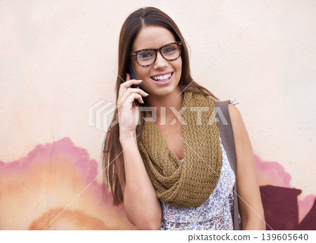 Portrait of happy woman, phone call or communication by wall for talking, conversation or gossip. Glasses, relax or excited female person for speaking chat, news or trendy urban fashion in discussion Portrait of happy woman, phone call or communication by wall for talking, conversation or gossip. Glasses, relax or excited female person for speaking chat, news or trendy urban fashion in discussion 139605640