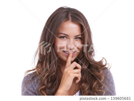 Happy woman, portrait and secret for gossip, confidential information or whisper on a white studio background. Face of female person, brunette or model smile with finger on lips for silence on mockup 139605681