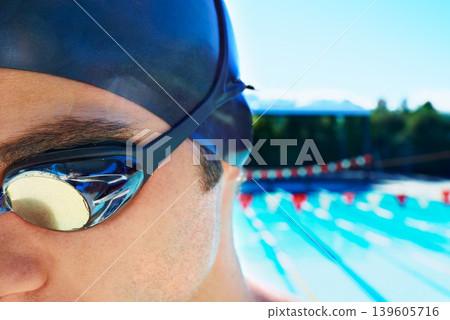 Swimming goggles, sports and face of man ready for exercise, outdoor workout or training for summer contest. Swimwear, mockup space and swimmer for waterpolo competition, fitness or cardio in pool Swimming goggles, sports and face of man ready for exercise, outdoor workout or training for summer contest. Swimwear, mockup space and swimmer for waterpolo competition, fitness or cardio in pool 139605716