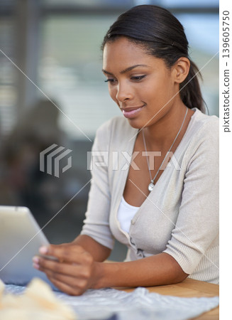 Tablet, reading and young woman in the office for research information on creative project. Digital technology, professional and female designer from Colombia working on internet in modern workplace. Tablet, reading and young woman in the office for research information on creative project. Digital technology, professional and female designer from Colombia working on internet in modern workplace. 139605750