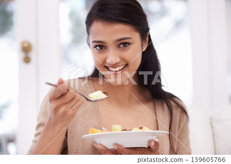 Happy woman, portrait and bowl of fruit salad for vitamin C, nutrition or healthy snack at home. Face of young female person, nutritionist or vegan smile for eating breakfast, diet or meal at house Happy woman, portrait and bowl of fruit salad for vitamin C, nutrition or healthy snack at home. Face of young female person, nutritionist or vegan smile for eating breakfast, diet or meal at house 139605766