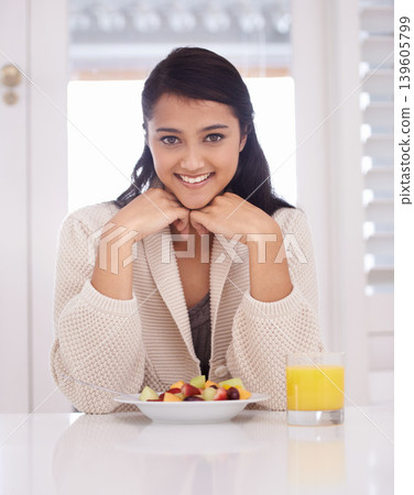 Breakfast, happy and portrait of woman with fruit salad and juice for nutrition, wellness and diet. Morning, home and person with drink, healthy food and snack for detox, vitamins and organic meal Breakfast, happy and portrait of woman with fruit salad and juice for nutrition, wellness and diet. Morning, home and person with drink, healthy food and snack for detox, vitamins and organic meal 139605799