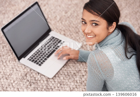 Portrait of girl on carpet with laptop, smile and relax with studying, research and browse on web in living room. Happy student woman on floor with computer, elearning and online education in home. 139606016