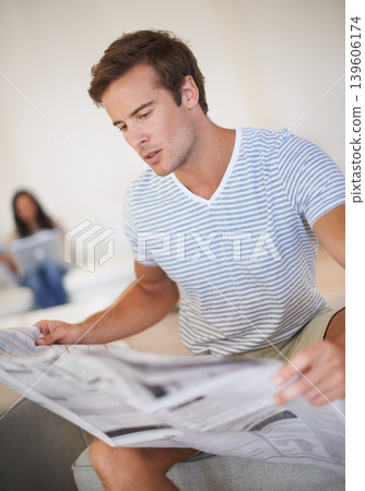 Man, reading and newspaper for morning information at home for global events, knowledge or politics. Male person, couch and print media discussion or worldwide crisis problem, international or report Man, reading and newspaper for morning information at home for global events, knowledge or politics. Male person, couch and print media discussion or worldwide crisis problem, international or report 139606174