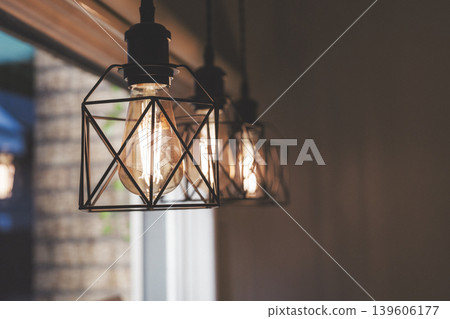 The store is lined with iron-framed light bulbs. 139606177