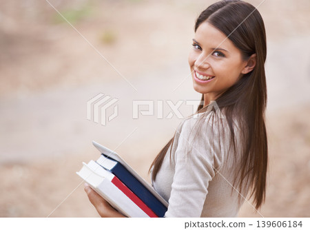 Student, portrait and books with tablet in nature, technology and education for learning at university. Park, young woman and face by happy connection, college and commitment with networking online 139606184