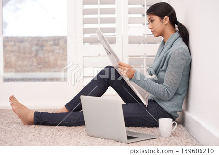 Newspaper, reading news and woman in a home with article, paper and press media for research. Morning, writer and remote work of an Indian female person with coffee and laptop for writing in a house Newspaper, reading news and woman in a home with article, paper and press media for research. Morning, writer and remote work of an Indian female person with coffee and laptop for writing in a house 139606210