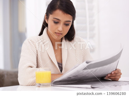 Breakfast, home and woman with newspaper and juice for nutrition, wellness and diet. Morning, reading news and person with drink, beverage and fruit smoothie for detox, vitamins and healthy lifestyle Breakfast, home and woman with newspaper and juice for nutrition, wellness and diet. Morning, reading news and person with drink, beverage and fruit smoothie for detox, vitamins and healthy lifestyle 139606280