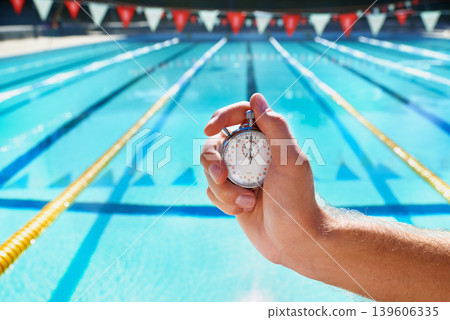 Hand, stopwatch and swimming pool for sport, training and workout with preparation for competition. Person, coach or mentor with clock, timer or watch for speed, progress and tracking lap for race Hand, stopwatch and swimming pool for sport, training and workout with preparation for competition. Person, coach or mentor with clock, timer or watch for speed, progress and tracking lap for race 139606335