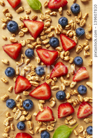 Granola with strawberries and blueberries flat lay food background 139607810