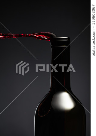 Red wine pours out of the bottle. Red wine pours out of the bottle. 139608067