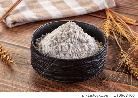White flour powder in the bowl White flour powder in the bowl 139608406