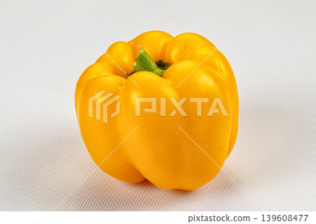 Ripe yellow sweet peppers on a dark textured background Ripe yellow sweet peppers on a dark textured background 139608477