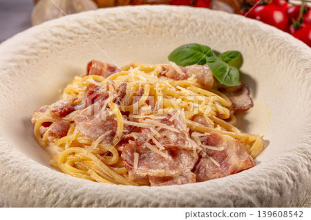 Appetizing Spaghetti Carbonara with Crispy Bacon, Parmesan Cheese, Fresh Basil Appetizing Spaghetti Carbonara with Crispy Bacon, Parmesan Cheese, Fresh Basil 139608542