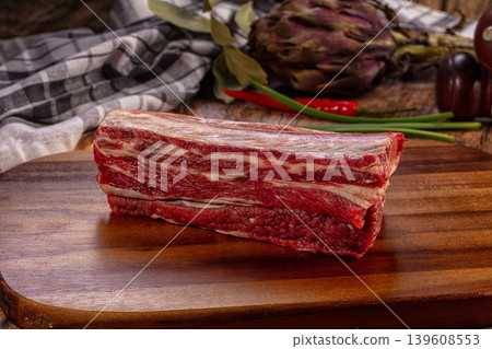 Raw Beef Short Ribs Fresh Rustic Wooden Cutting Board Garlic Chili Artichoke Raw Beef Short Ribs Fresh Rustic Wooden Cutting Board Garlic Chili Artichoke 139608553
