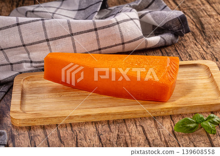 Orange Cheese Wedge, Wooden Board, Plaid Cloth 139608558