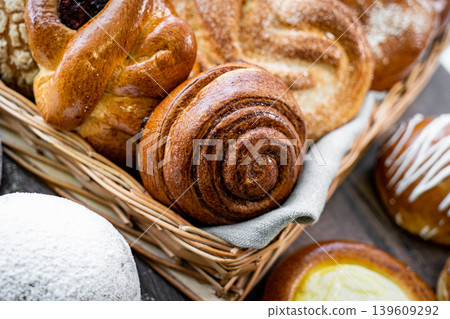 Fresh pastries buns wicker basket rustic style bakery Fresh pastries buns wicker basket rustic style bakery 139609292