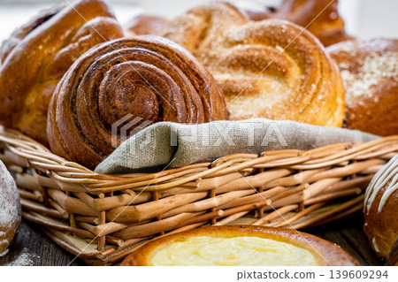 Fresh pastries buns wicker basket rustic style bakery Fresh pastries buns wicker basket rustic style bakery 139609294