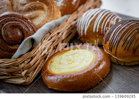 Fresh pastries buns wicker basket rustic style bakery Fresh pastries buns wicker basket rustic style bakery 139609295