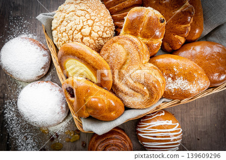 Fresh pastries buns wicker basket rustic style bakery Fresh pastries buns wicker basket rustic style bakery 139609296