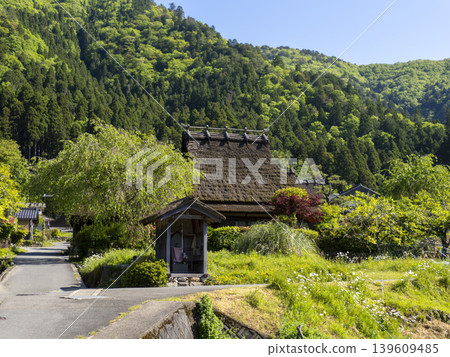 The scenery of Miyama thatched-roof village covered in fresh greenery. The scenery of Miyama thatched-roof village covered in fresh greenery. 139609485