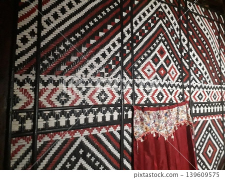 Traditional Javanese Gedhek Bamboo Wall with Epic Ethnic Ornamental Pattern Traditional Javanese Gedhek Bamboo Wall with Epic Ethnic Ornamental Pattern 139609575