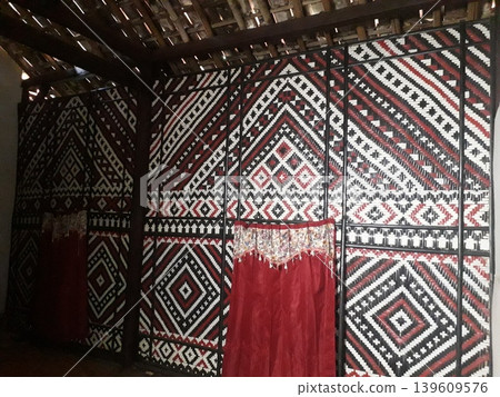 Authentic Indonesian Home Interior featuring Ornate Woven Bamboo Panel Authentic Indonesian Home Interior featuring Ornate Woven Bamboo Panel 139609576