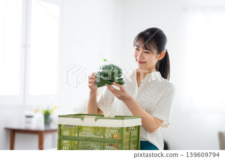 A woman looking at vegetables A woman looking at vegetables 139609794