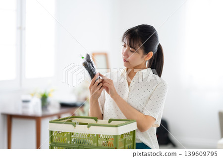 A woman looking at vegetables A woman looking at vegetables 139609795