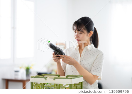 A woman looking at vegetables A woman looking at vegetables 139609796
