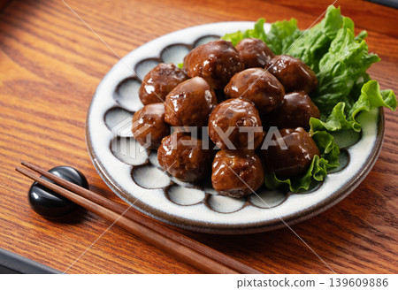 Teriyaki meatballs on a wooden tray with chopsticks. Dining table, cooking ingredients, Japanese food. 139609886