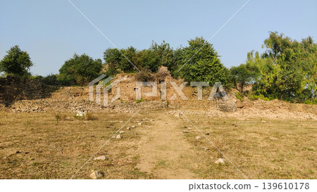 Tilla jogian wide view of crumbling temple walls and dry open land pakistan Tilla jogian wide view of crumbling temple walls and dry open land pakistan 139610178