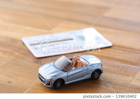 Image of a car and a driver's license 139610402