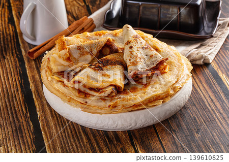 Thin homemade golden pancaces stack Thin homemade golden pancaces stack 139610825