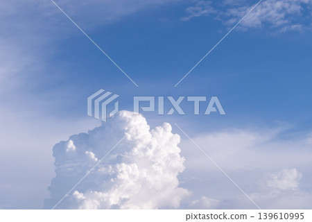 Bright white clouds rising in blue sky with soft sunlight and peaceful atmosphere creating natural weather background Bright white clouds rising in blue sky with soft sunlight and peaceful atmosphere creating natural weather background 139610995