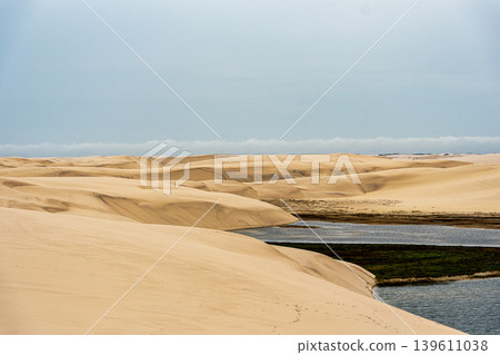 Dunes and lagoons of Atins, Lencois Maranhenses, Barreirinhas, Brazil. White sand dunes with pools of fresh water 139611038