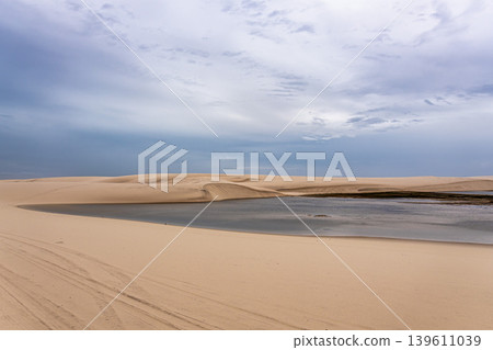 Dunes and lagoons of Atins, Lencois Maranhenses, Barreirinhas, Brazil. White sand dunes with pools of fresh water Dunes and lagoons of Atins, Lencois Maranhenses, Barreirinhas, Brazil. White sand dunes with pools of fresh water 139611039