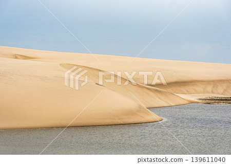 Dunes and lagoons of Atins, Lencois Maranhenses, Barreirinhas, Brazil. White sand dunes with pools of fresh water Dunes and lagoons of Atins, Lencois Maranhenses, Barreirinhas, Brazil. White sand dunes with pools of fresh water 139611040